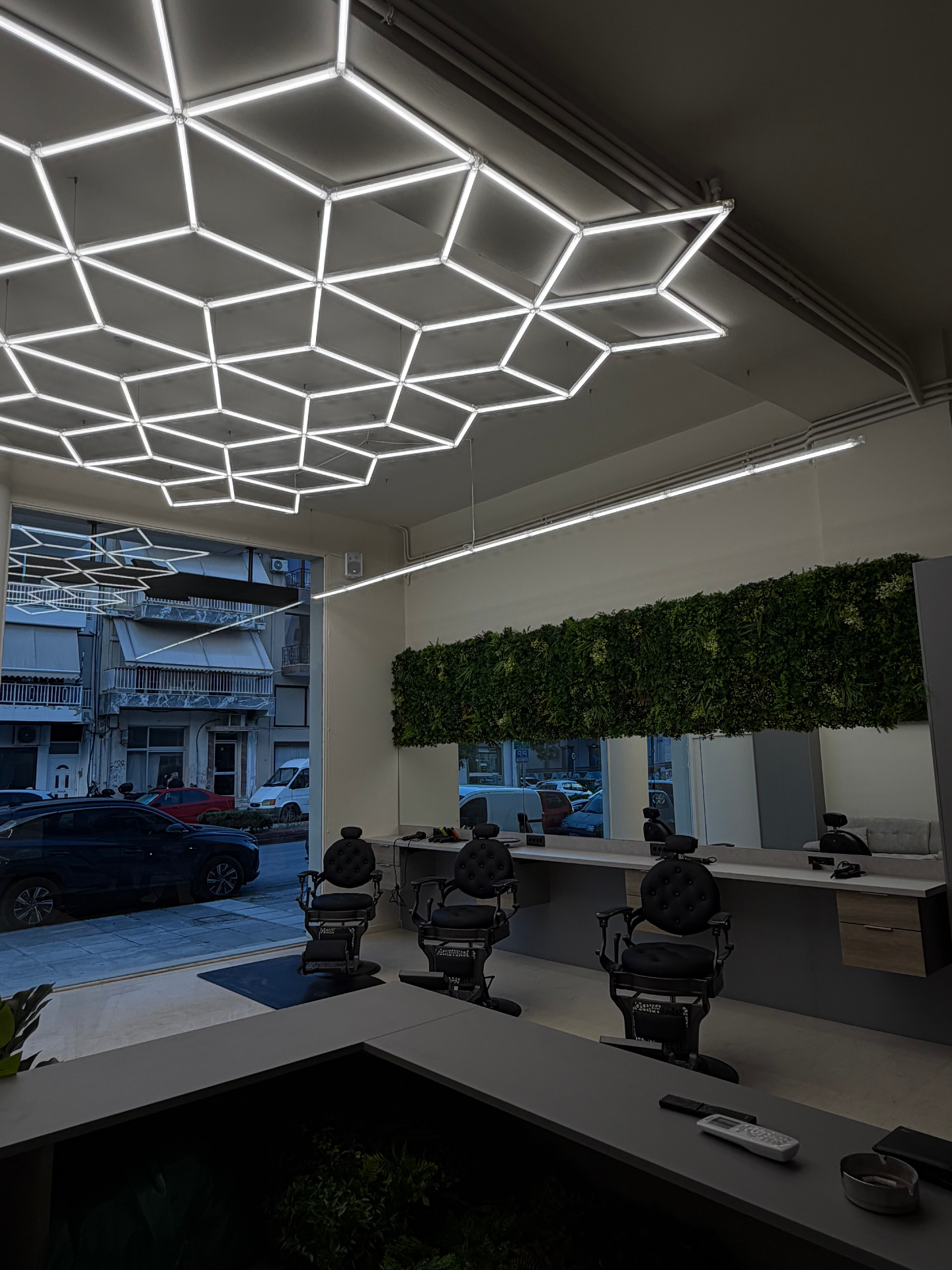 Studio 1 barber chairs with geometric ceiling lights